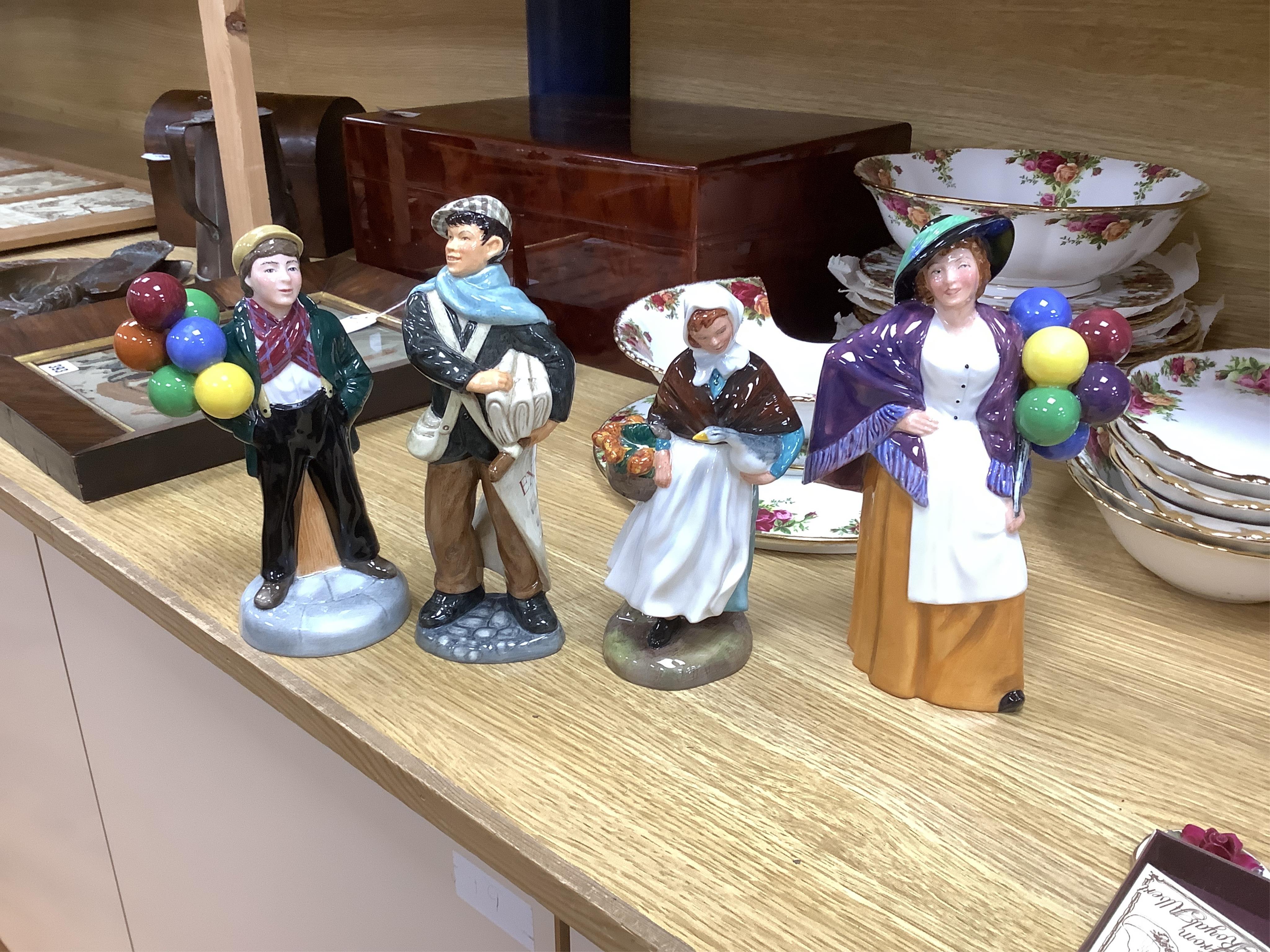 A collection of Royal Doulton figures to include The Old Balloon Seller, Doctor, Votes for Women and The Detective